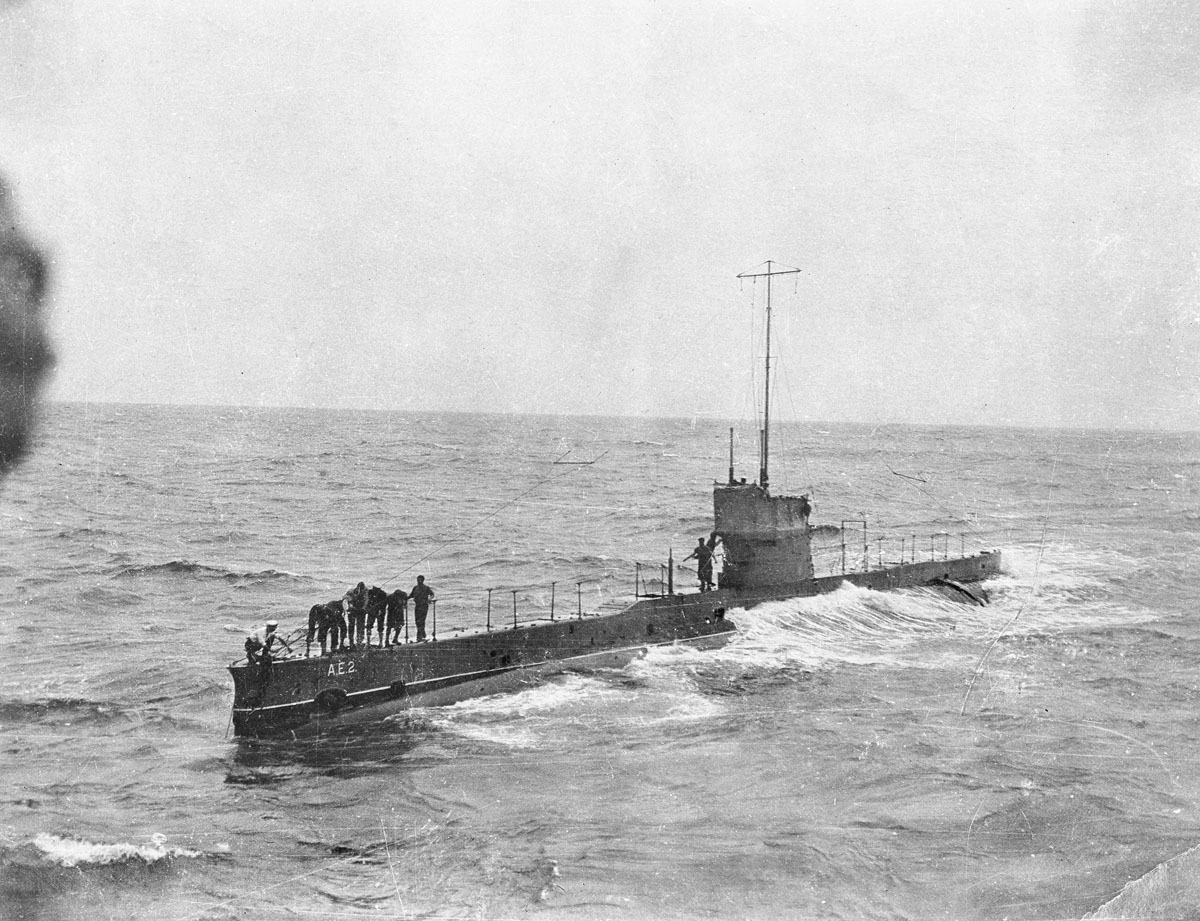 Australian Naval submarine AE2 escorting the troopship Berrima in the Indian Ocean, some of the crew are on deck. The AE2 was later sunk in the sea of Marmara.